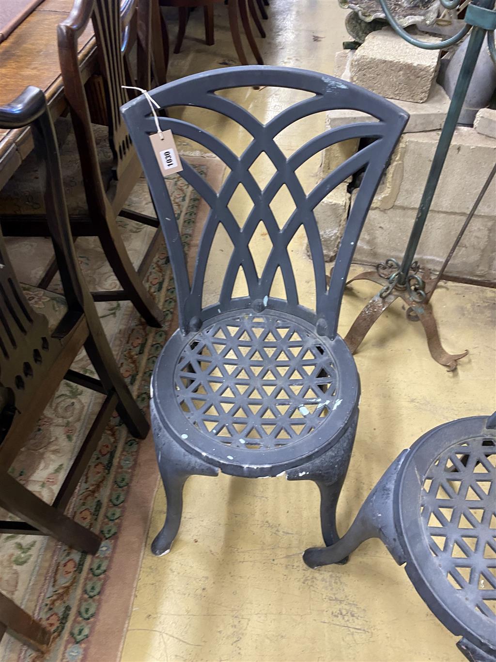 A circular painted aluminium garden table, 60cm diameter together with two garden chairs